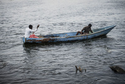 People in boat on sea