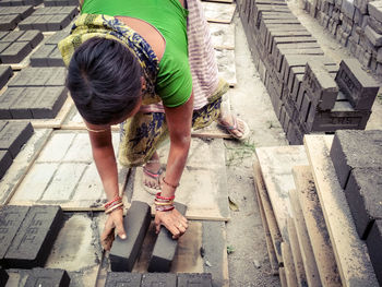 Low section of man working on wood