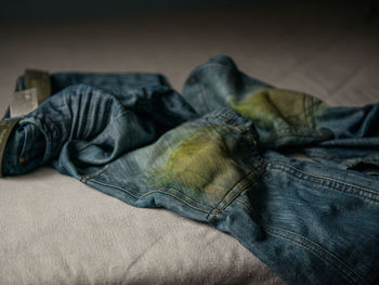 Close-up of man resting on bed at home