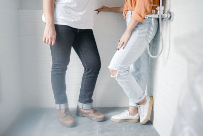 Low section of women standing in corridor