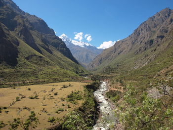 View of stream along mountain range