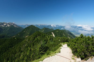 Scenic view of mountains against clear blue sky