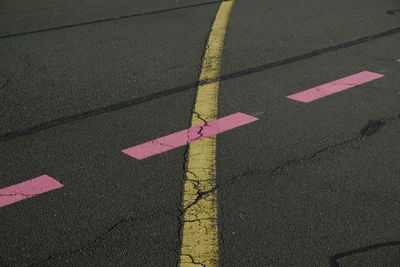 High angle view of arrow sign on street