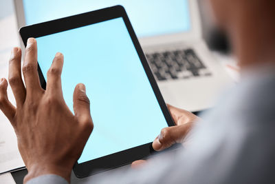 Cropped hands using digital tablet