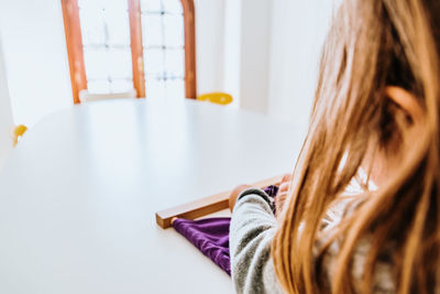 Rear view of woman at home