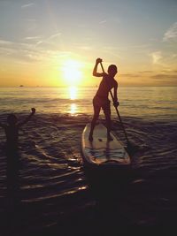 People on beach at sunset