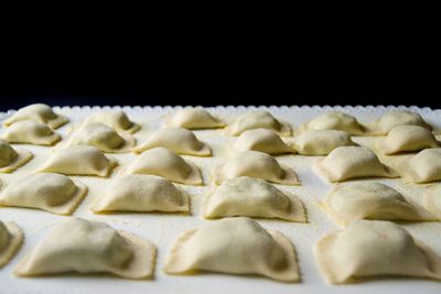 Close-up of coffee beans against black background