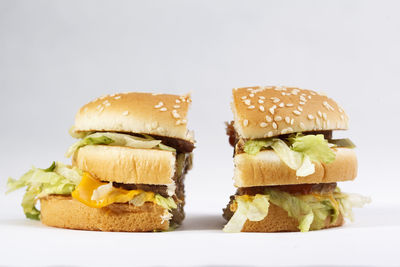 Close-up of burger against white background
