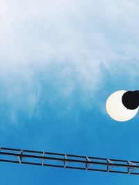 Low angle view of street light against cloudy sky