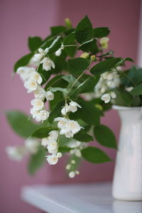 Close-up of white flower vase on table