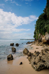 Rocks, coastline, sea and sky at padang padang beach in bali indonesia