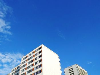 Low angle view of buildings against blue sky