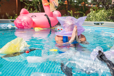 Reflection of man in swimming pool