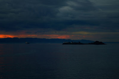 Scenic view of sea against dramatic sky