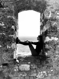 Woman in an old castle window