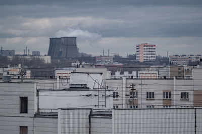 Buildings in city against sky