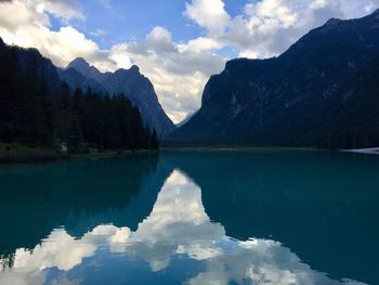 Scenic view of lake and mountains against sky