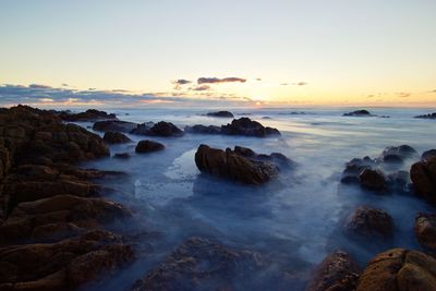 Scenic view of sea against sky during sunset