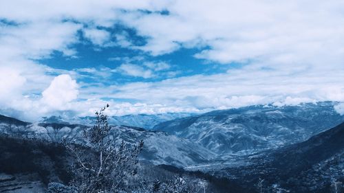 Scenic view of snowcapped mountains against sky