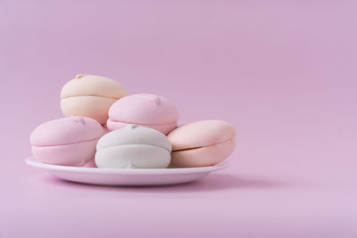 Close-up of candies against white background