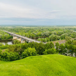 Scenic view of green landscape against sky