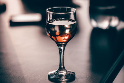 Close-up of wine glass on table