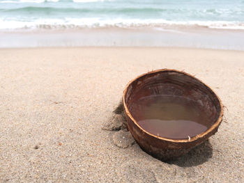 Close-up of sunglasses on beach