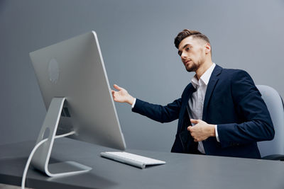 Businessman using laptop on table