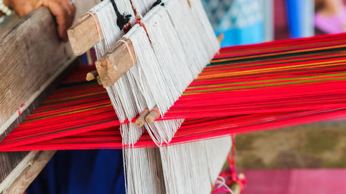 Close-up of multi colored umbrella on wood