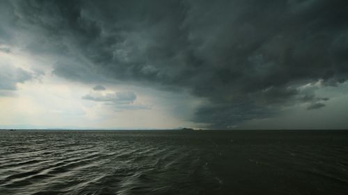 Scenic view of storm clouds over land