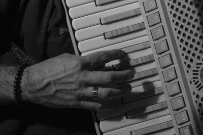 Close-up of man playing piano