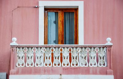 Close-up of railing against window