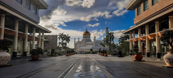 Panoramic view of buildings in city against sky