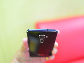 Close-up of hand holding smart phone