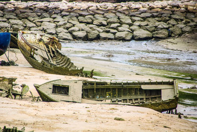 View of abandoned boat on beach