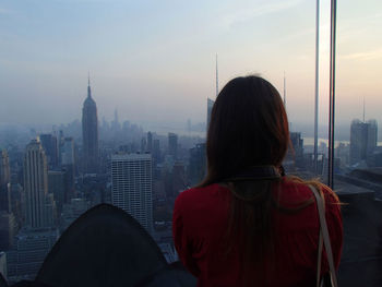 Woman looking at cityscape