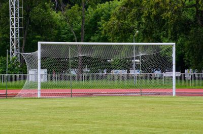 Soccer field against trees