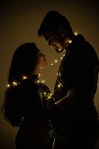 Side view of couple with hands