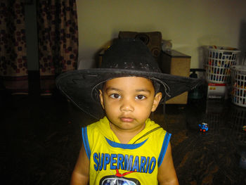 Portrait of innocent boy wearing hat at home