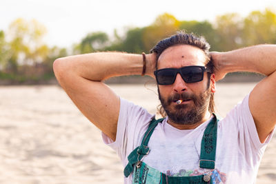 Portrait of young man wearing sunglasses