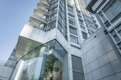 Low angle view of modern building against clear sky