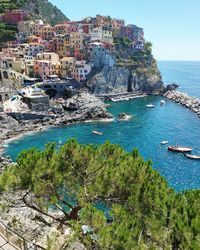 High angle view of townscape by sea