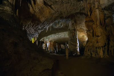 Low angle view of illuminated cave