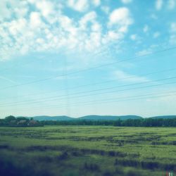 Scenic view of landscape against cloudy sky