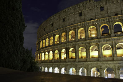 Low angle view of historical building at night