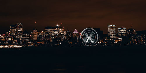 Illuminated buildings in city at night