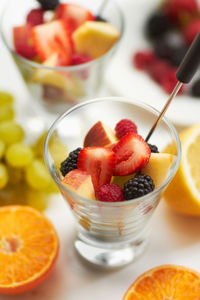 Close-up of fruits in glass on table