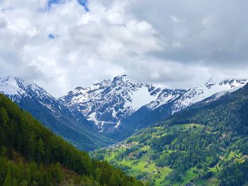 Scenic view of snowcapped mountains against sky