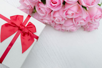 High angle view of pink flower on table