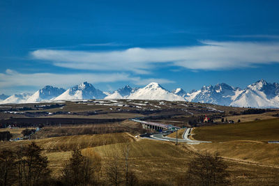 Scenic view of snowcapped mountains against sky